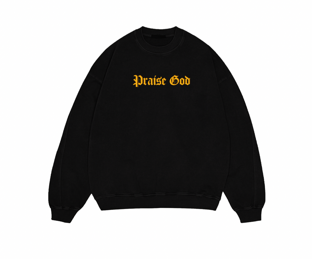 Black sweatshirt with 'Praise God' text in yellow on a white background
