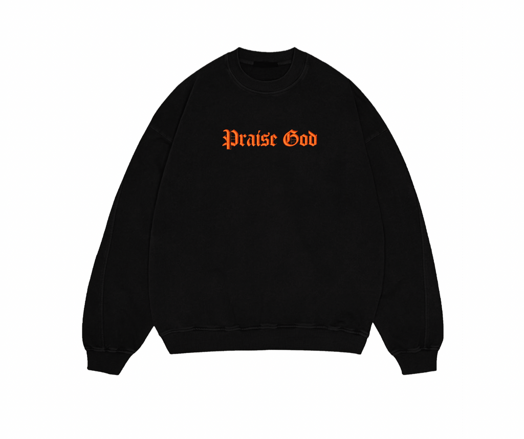 Black sweatshirt with 'Praise God' text in orange on a white background