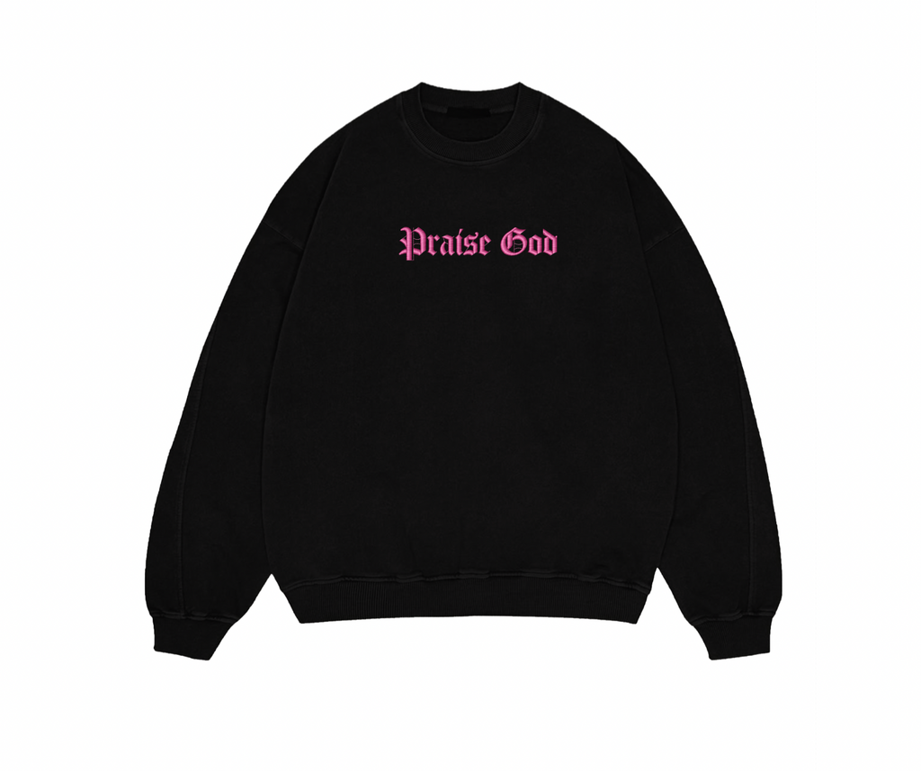 Black sweatshirt with 'Praise God' text in pink on a white background